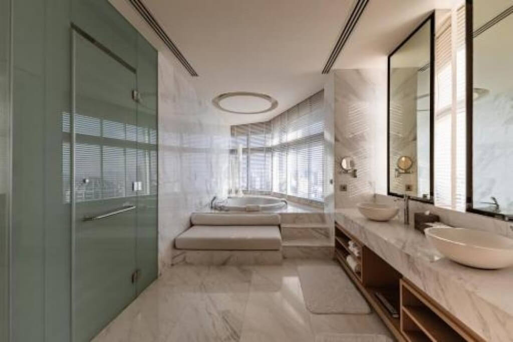 Bangkok Marriott Hotel Sukhumvit spacious bathroom with marble design and large mirror