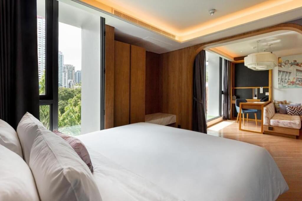 Volve Hotel Bangkok spacious suite with large sofa and seating area