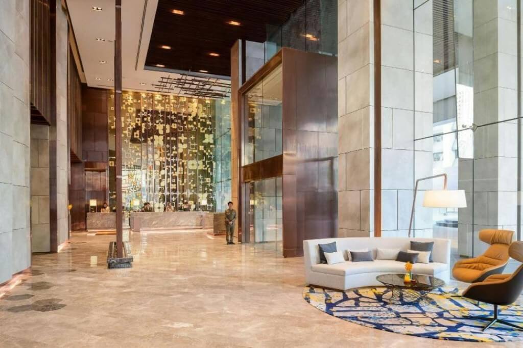 Hotel Nikko Bangkok lobby with high ceiling and elegant gold decor