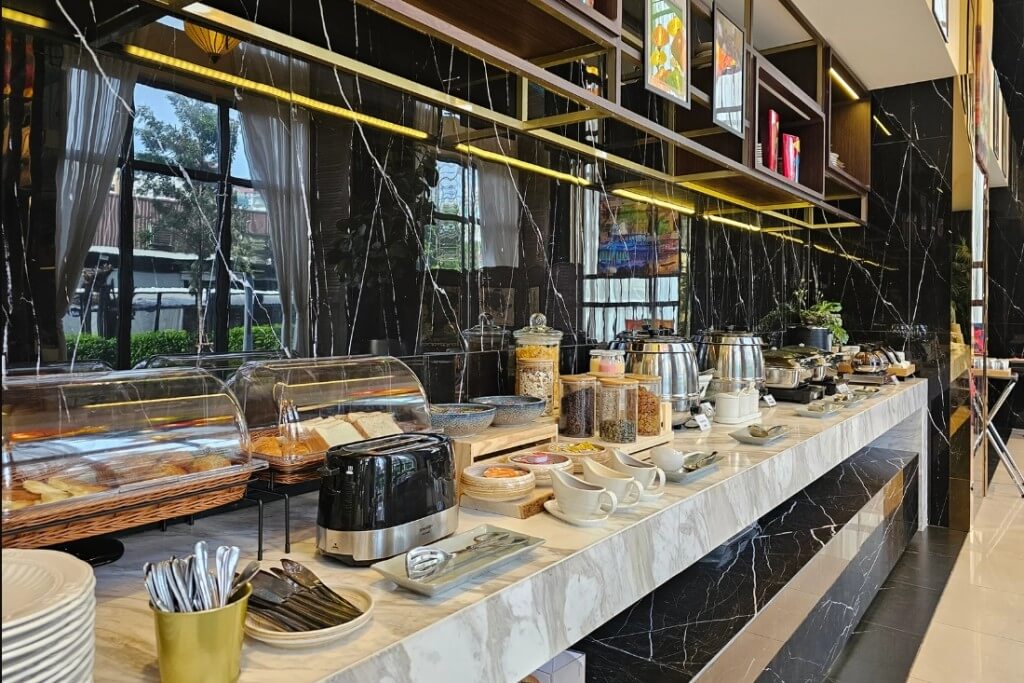 Clean and organized breakfast buffet with delicious bread at Ramada Plaza Bangkok