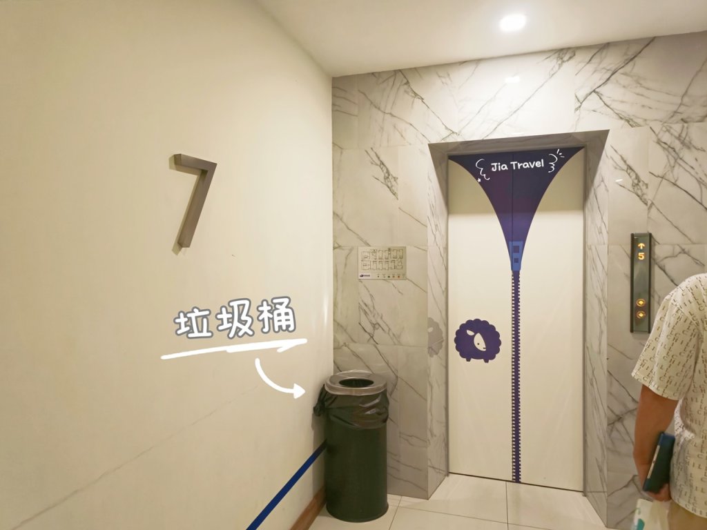 Kokotel Bangkok Sukhumvit 50 gray trash bin placed at the elevator lobby area