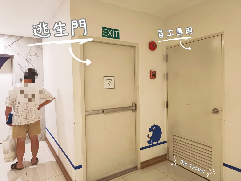 Kokotel Bangkok Sukhumvit 50 red emergency exit door located immediately next to the elevator door