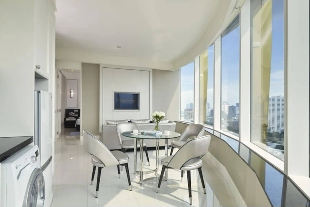 Washing machine in kitchen area of corner suite at Grande Centre Point Sukhumvit 55 Bangkok