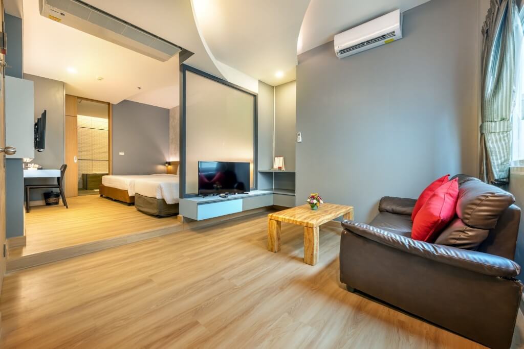 one bedroom suite living area at Qiu Hotel Sukhumvit Bangkok