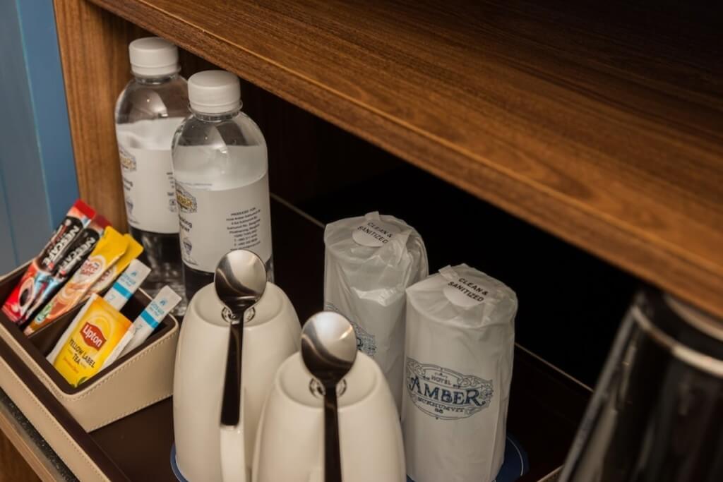 Hotel Amber Sukhumvit 85 mini bar with tea bags and bottled water