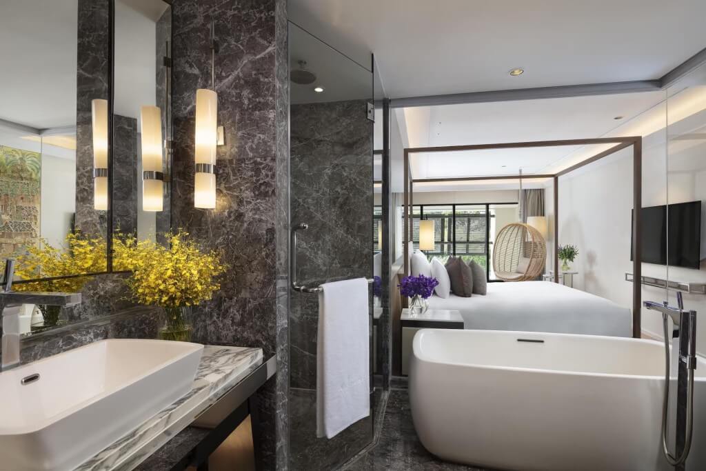 Siam Kempinski Hotel Bangkok duplex Kawana room level two view from bathroom to bedroom