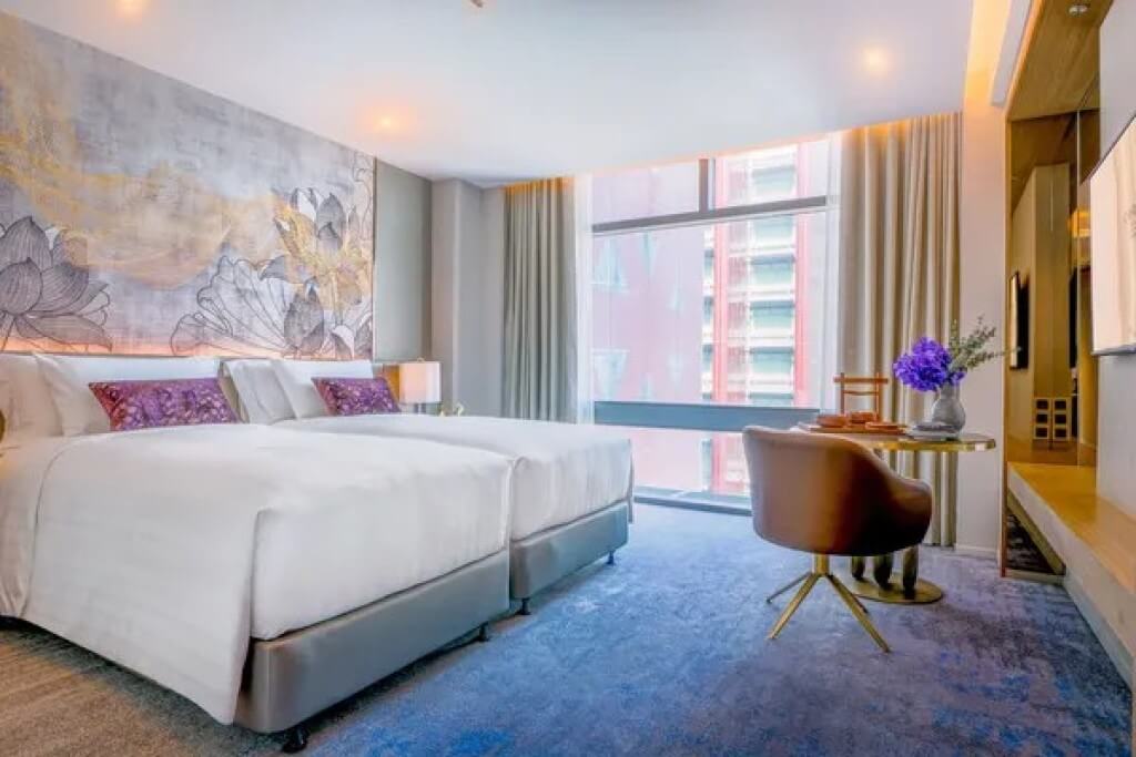 Chatrium Grand Bangkok three bedroom suite twin bed and window