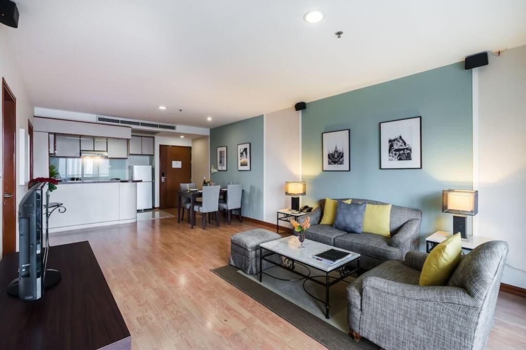 Living dining kitchen area in Two Bedroom Family Suite at Evergreen Place Siam by UHG