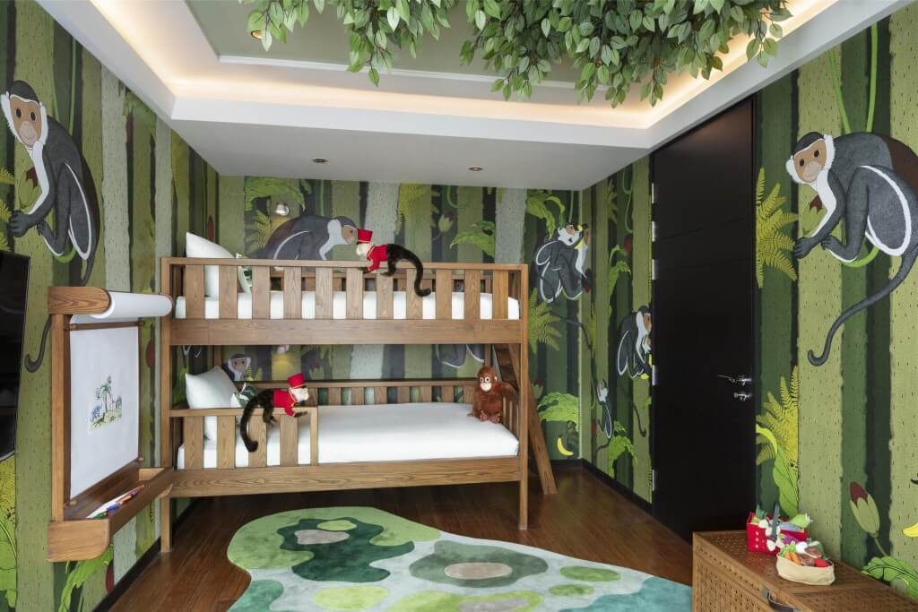 Siam Kempinski Hotel Bangkok two-bedroom family room animal kingdom themed kids room with stuffed animals and wall chalkboard