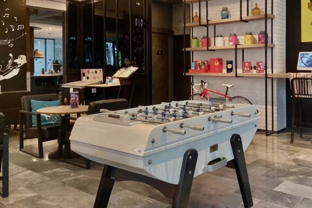 Cross Vibe Bangkok Sukhumvit lobby leisure area computer and foosball