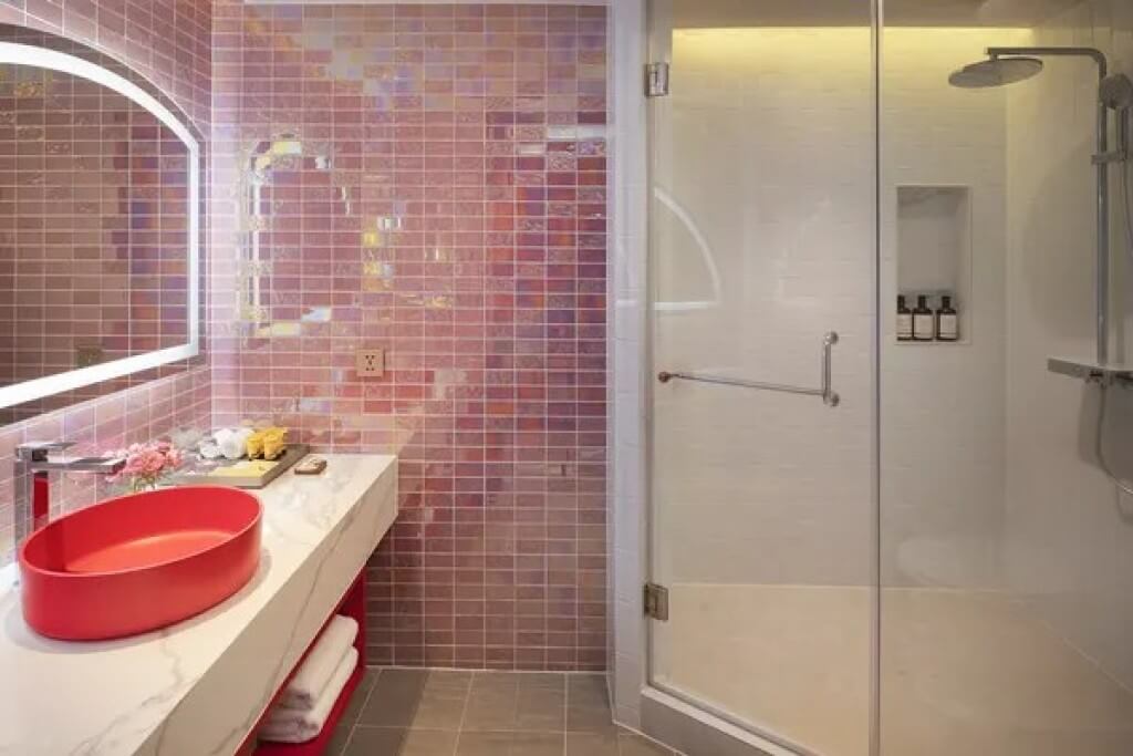 Pathumwan Princess Hotel two bedroom family suite bathroom with pink mosaic tiles and separate shower