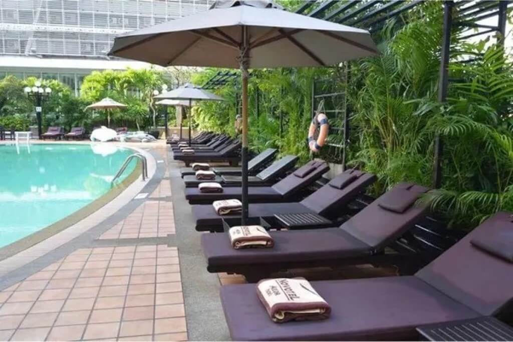 Novotel Bangkok Siam Square swimming pool lounge chairs with evening breeze