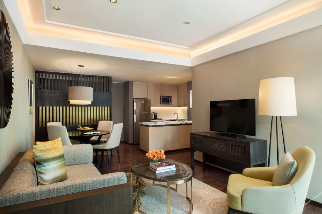 Siam Kempinski Hotel Bangkok two-bedroom family room complete living room dining room and kitchen