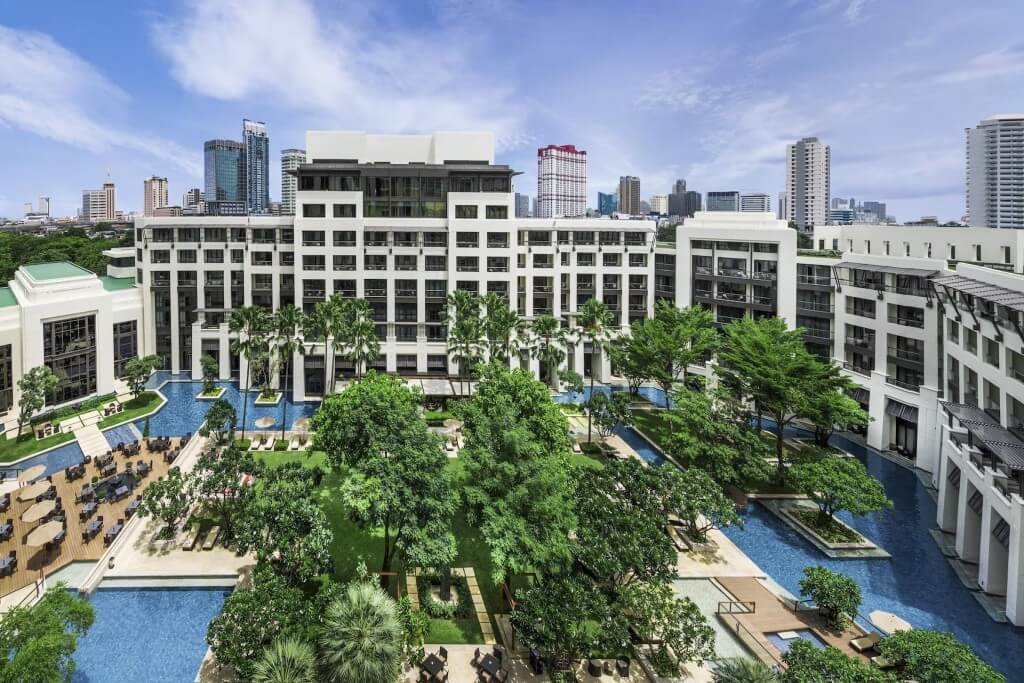 Siam Kempinski Hotel Bangkok building wings surrounding central courtyard swimming pool