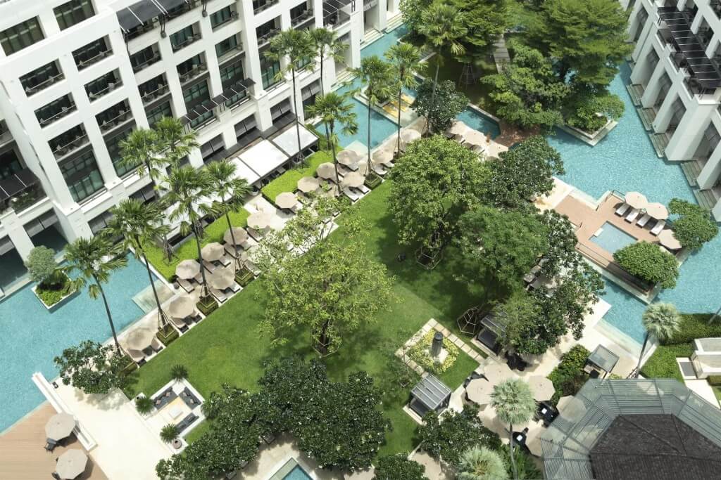 Siam Kempinski Hotel Bangkok swimming pool resort-style atmosphere with tropical plants