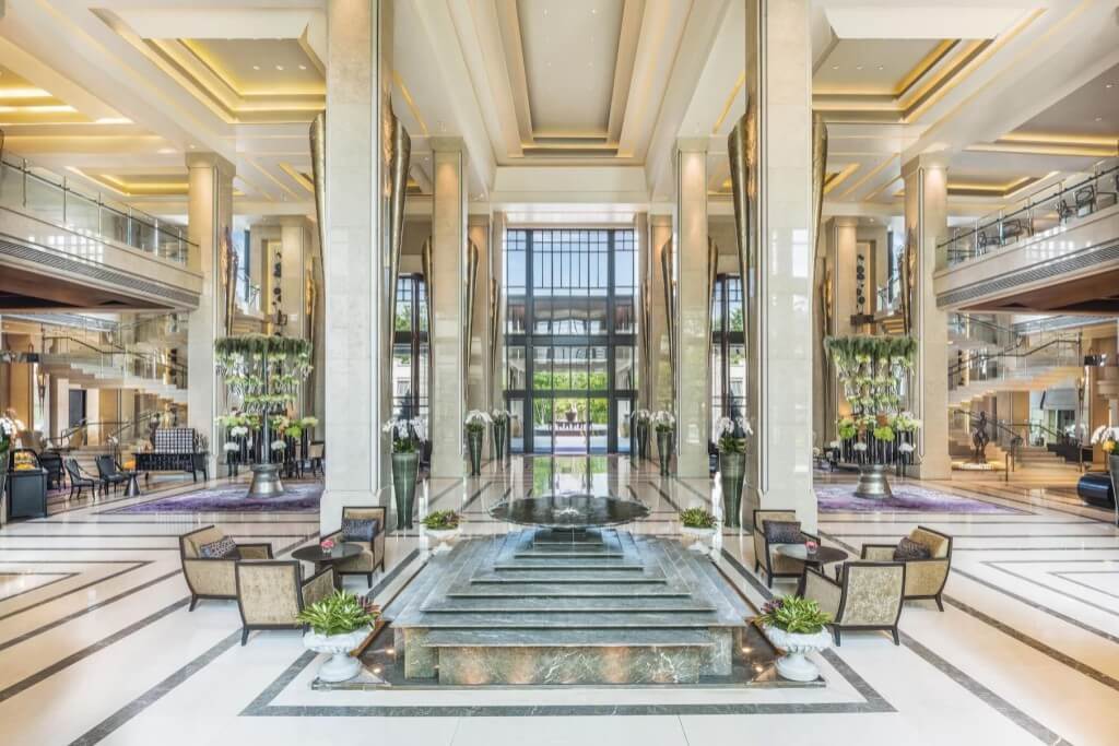 Siam Kempinski Hotel Bangkok three-story high lobby with luxury furniture