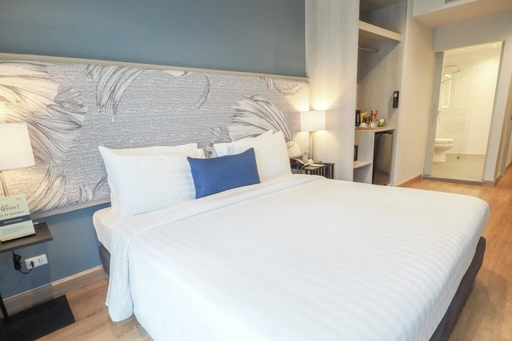 Superior room bed with minibar at Evergreen Place Siam by UHG