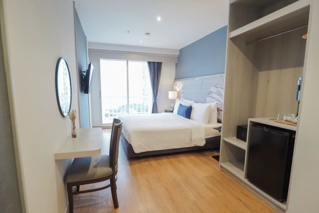 View from entrance to bed in Superior room at Evergreen Place Siam by UHG