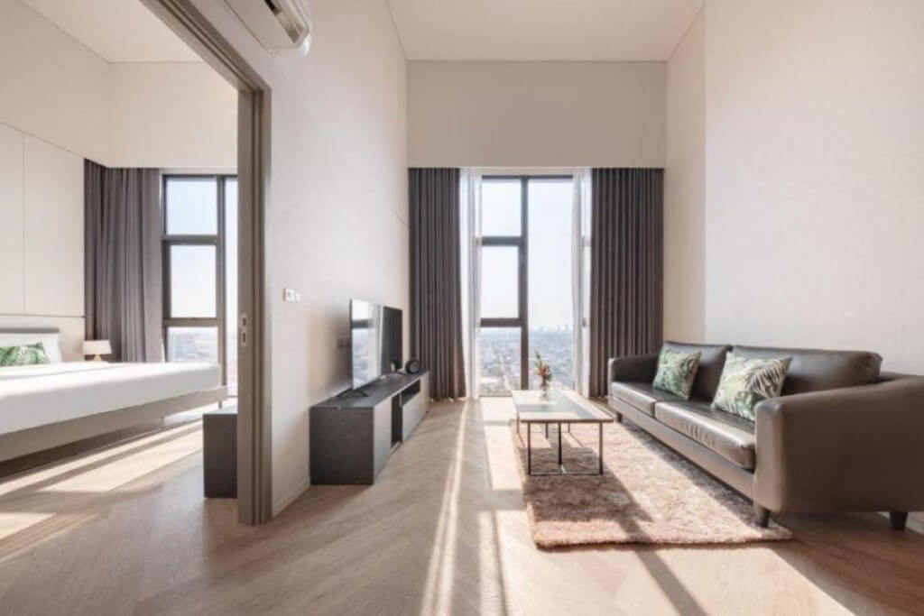 Ramada by Wyndham Bangkok Sukhumvit 87 bright living room with separate bedroom door