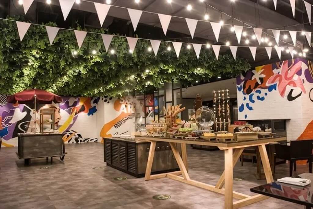 Novotel Bangkok Siam Square breakfast buffet station with vibrant colorful food display