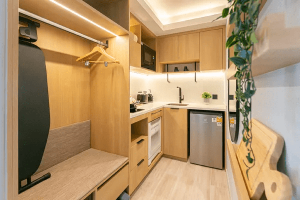Kitchen wardrobe and ironing board in twin suite at Sacha Thonglor