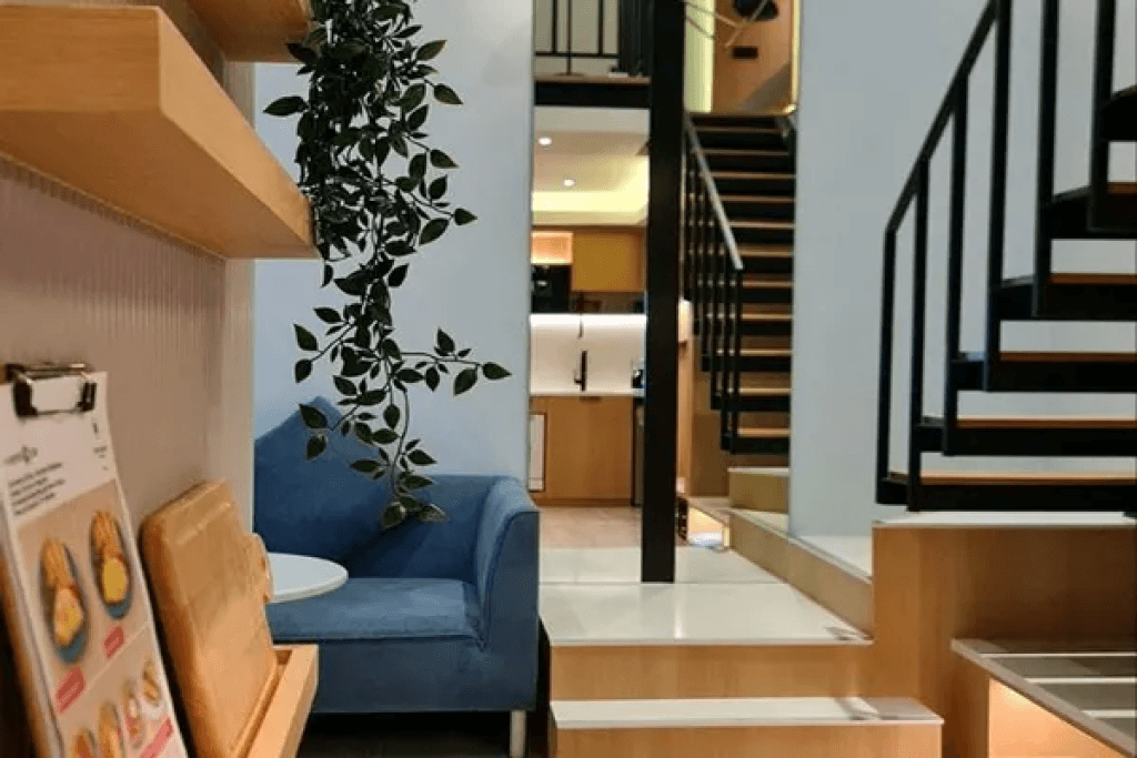Stairs and sofa in loft suite at Sacha Thonglor