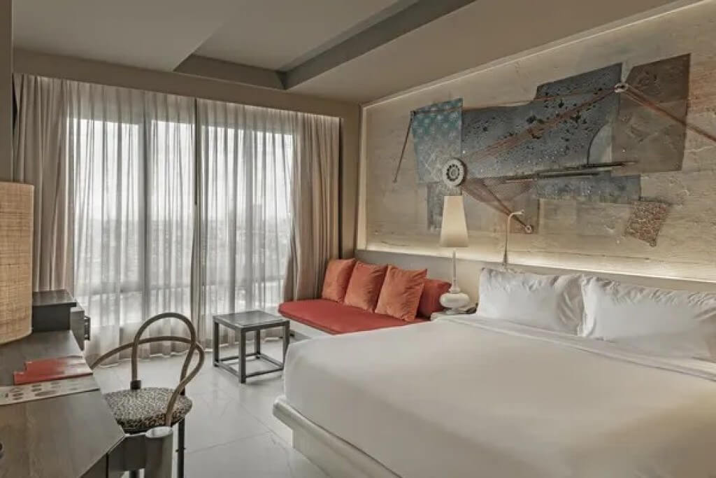 Siam Design Hotel Bangkok double room with bed sofa and floor-to-ceiling window