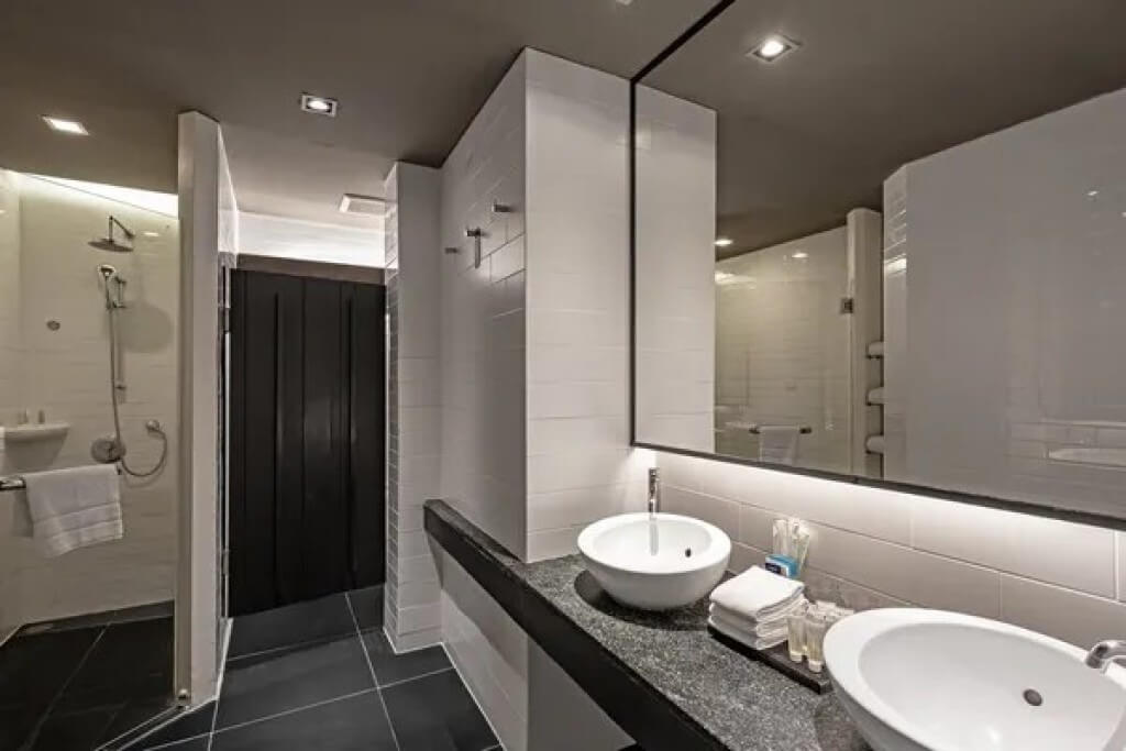 Siam Design Hotel Bangkok triple room bathroom with dual sinks and dry-wet separation
