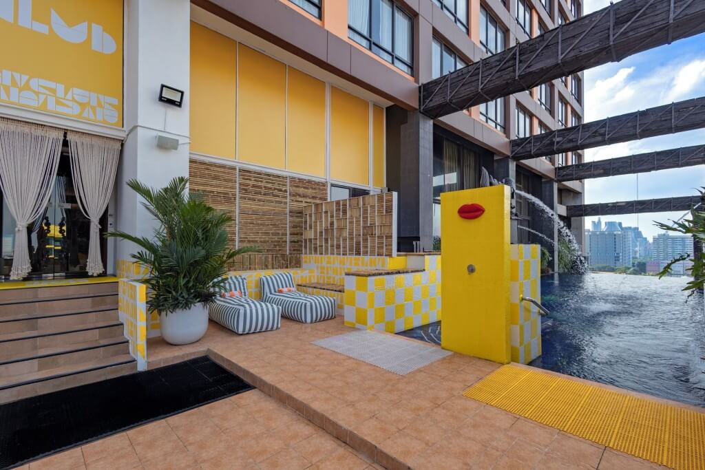 Siam Design Hotel Bangkok infinity pool with colorful decor and city view